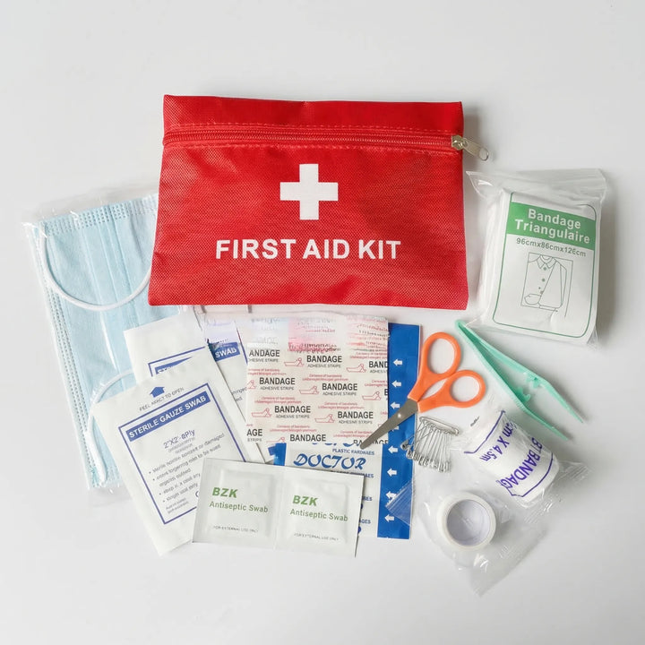 Portable tactical first aid kit with essential medical supplies for emergency preparedness in outdoor activities & travel.