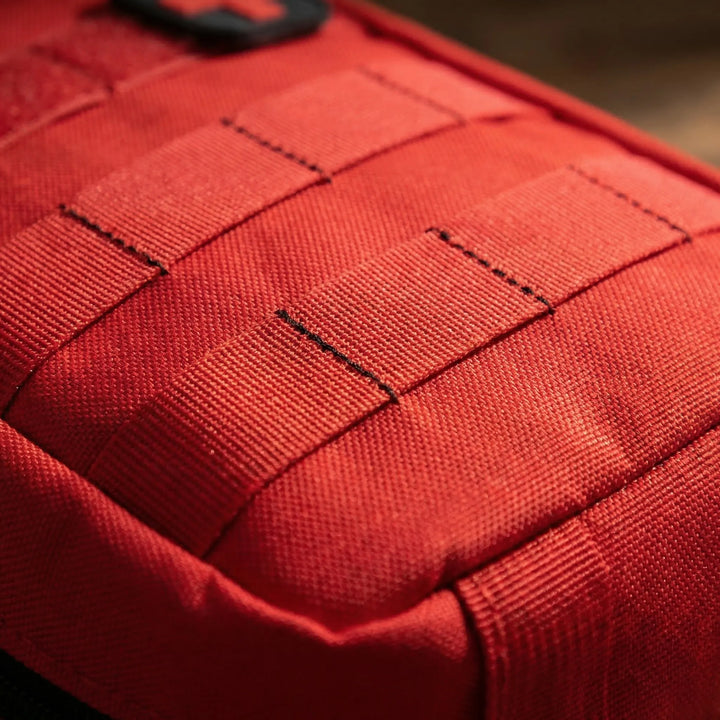 Rugged compact first aid pouch for hiking & outdoor adventures. Essential medical kit for survival & emergencies.