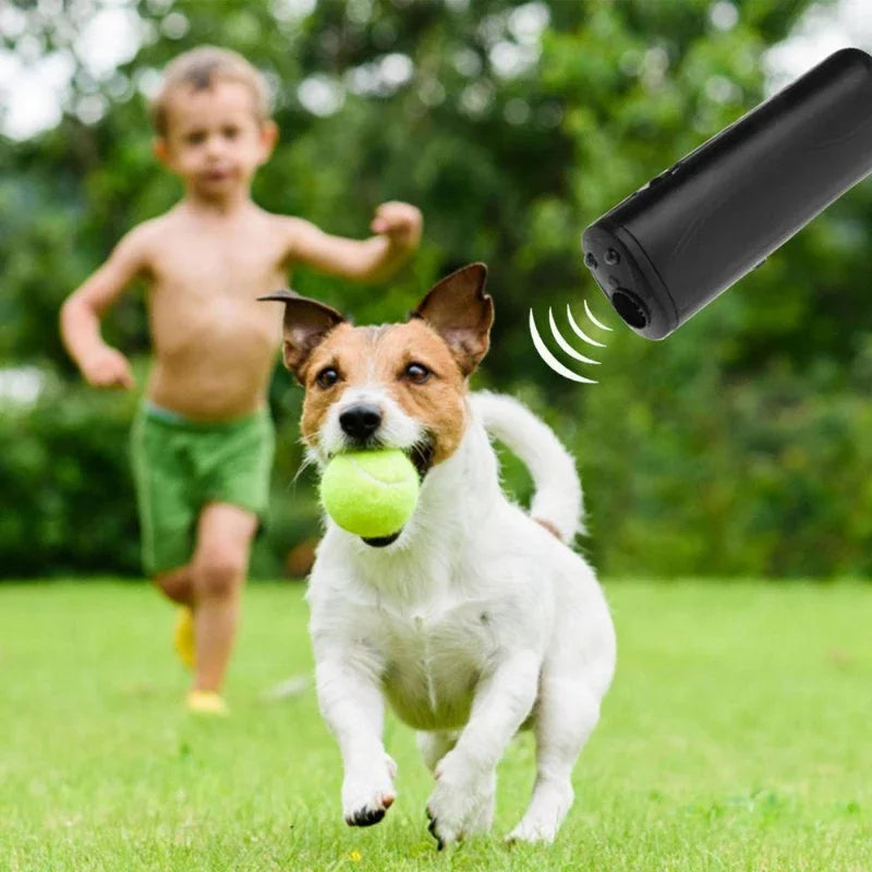 Handheld ultrasonic bark control device being used for dog training. Pet behavior aid & bark deterrent.