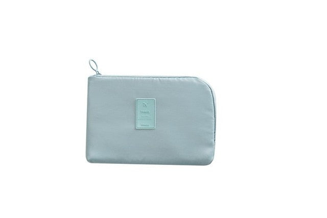 Unisex travel tech accessory bag for efficient cable management and gadget storage.
