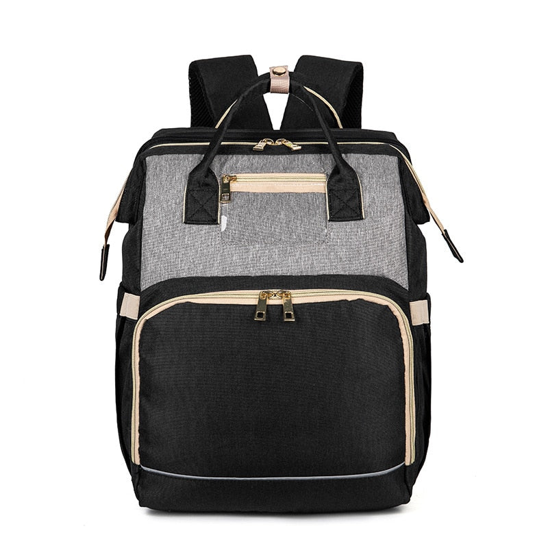 Waterproof convertible diaper bag and travel bassinet, ready for any adventure with your baby gear.