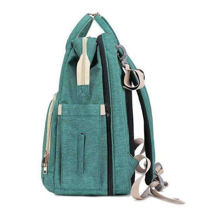 Diaper bag transforming into a convenient travel bassinet & changing pad for on-the-go parents.