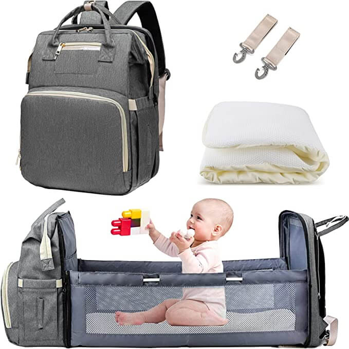 Essential travel diaper bag with built-in portable bassinet, changing station for easy outings.