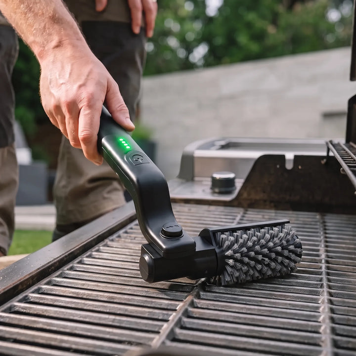 Cordless electric grill brush with powerful rotary action for effortless outdoor BBQ cleaning & heat-resistant performance.