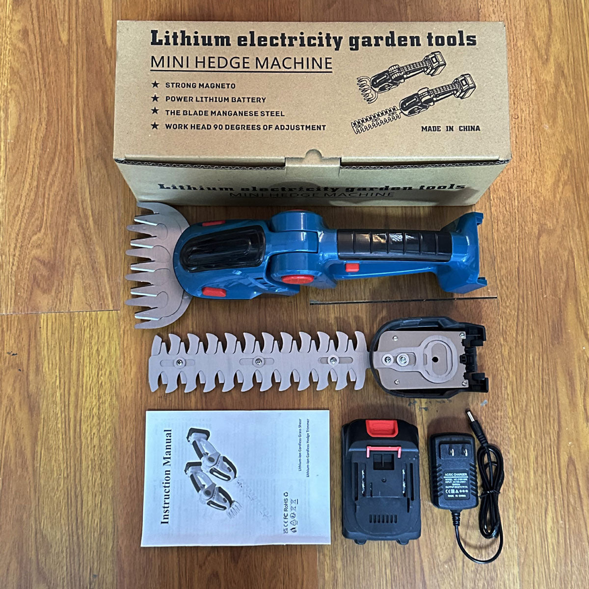 Rechargeable mini bush trimmer next to a freshly trimmed hedge, illustrating its use