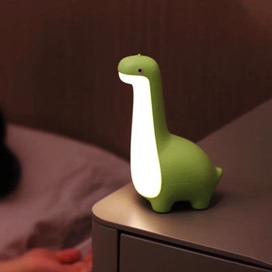 Cozy dinosaur night light for kids' rooms. Soft silicone, LED, touch control, rechargeable lamp.