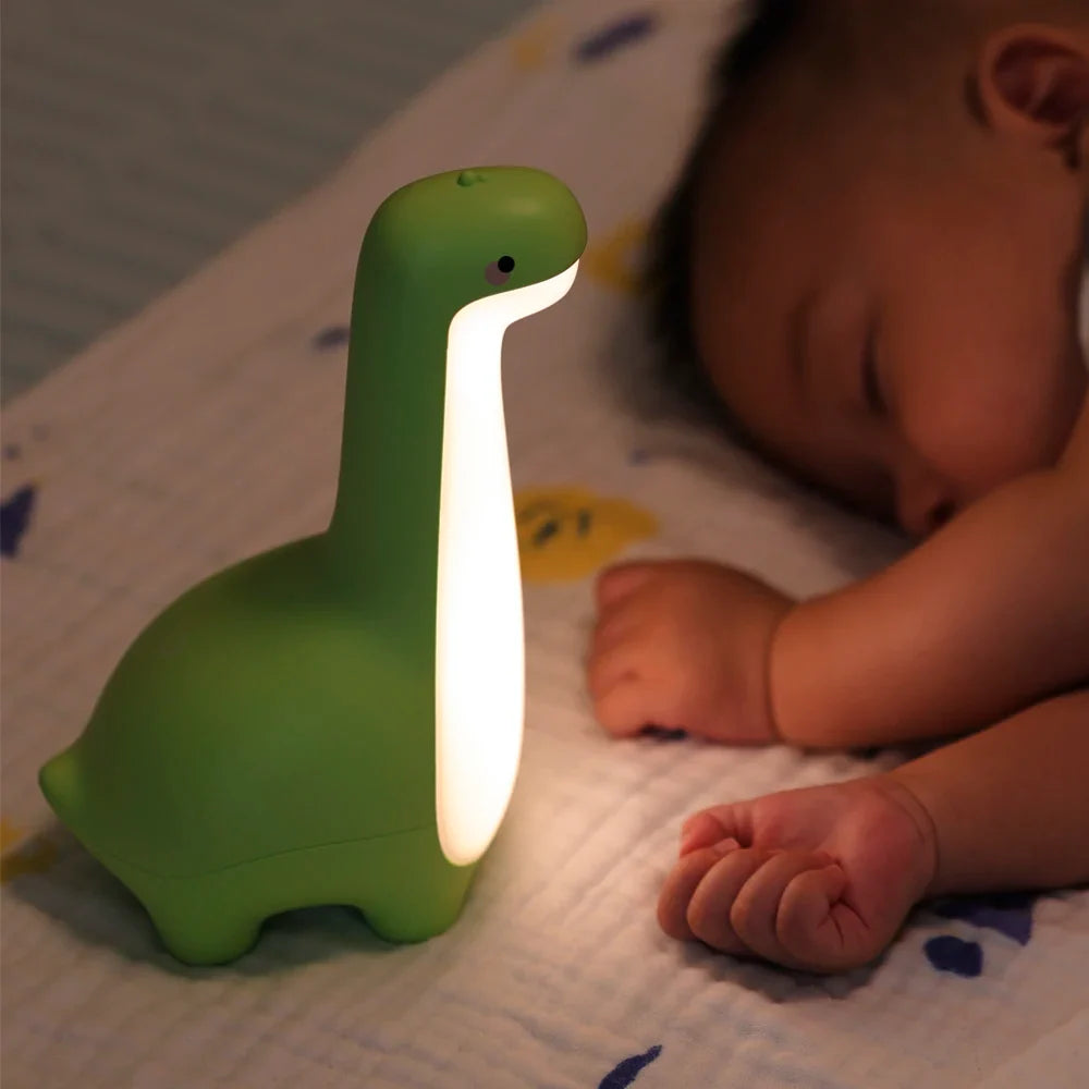 Cute LED dinosaur touch lamp for kids' rooms. Rechargeable & dimmable night light, perfect for nurseries.