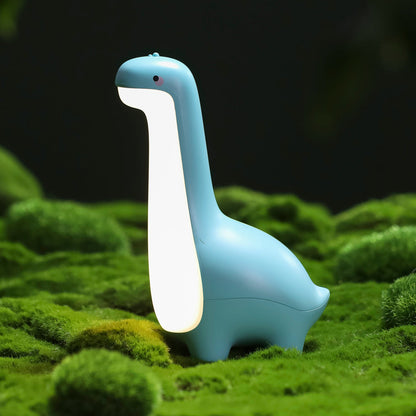 Dino night light illuminating a cozy kids' room. Safe silicone LED lamp, touch-controlled & rechargeable.