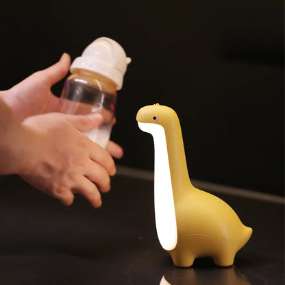 Rechargeable silicone dinosaur night light. Touch-sensitive LED lamp, ideal decor for children's bedrooms.