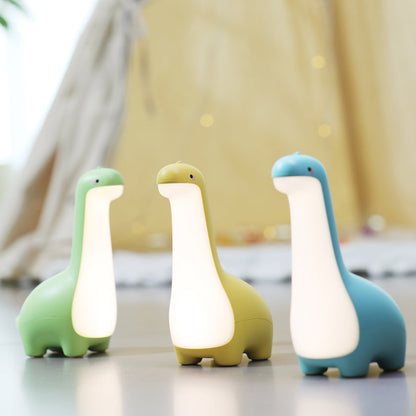 Close-up of a cozy LED dinosaur night light. Soft silicone design, perfect for a kids' room or nursery.