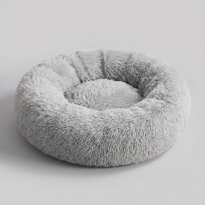 Large calming dog bed, ultra-soft faux fur for deep sleep & anxiety relief.