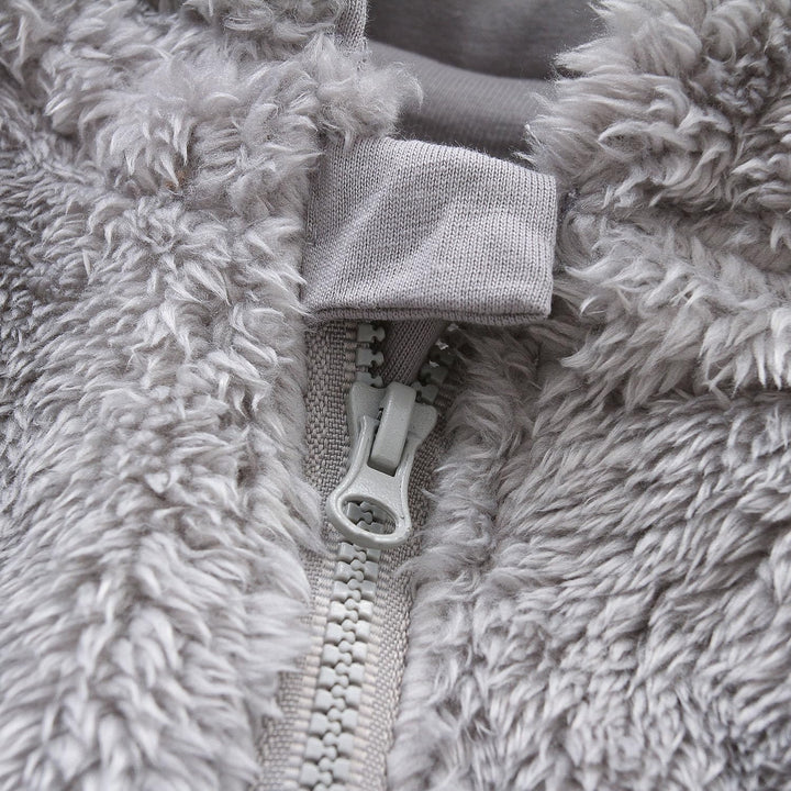 Cozy hooded baby romper, fleece interior, perfect for cold-weather adventures.