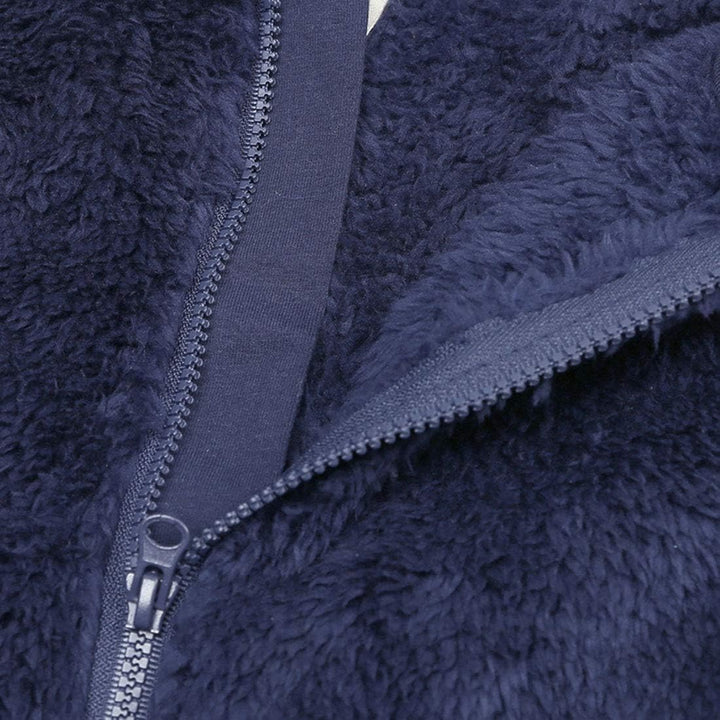 Snug fleece-lined baby jumpsuit with hood, perfect for keeping newborns warm.