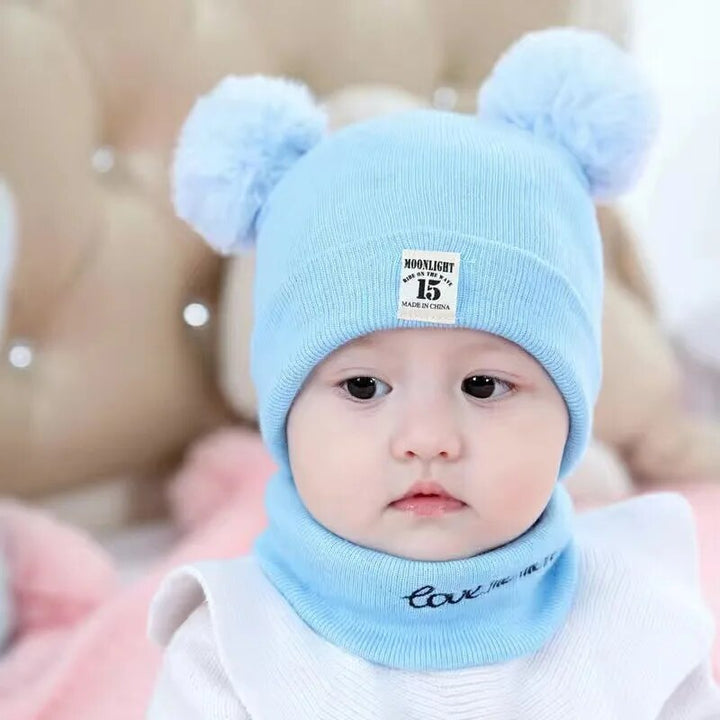 Cozy knit children's winter hat with a fluffy pom-pom for stylish warmth; ideal for boys & girls.