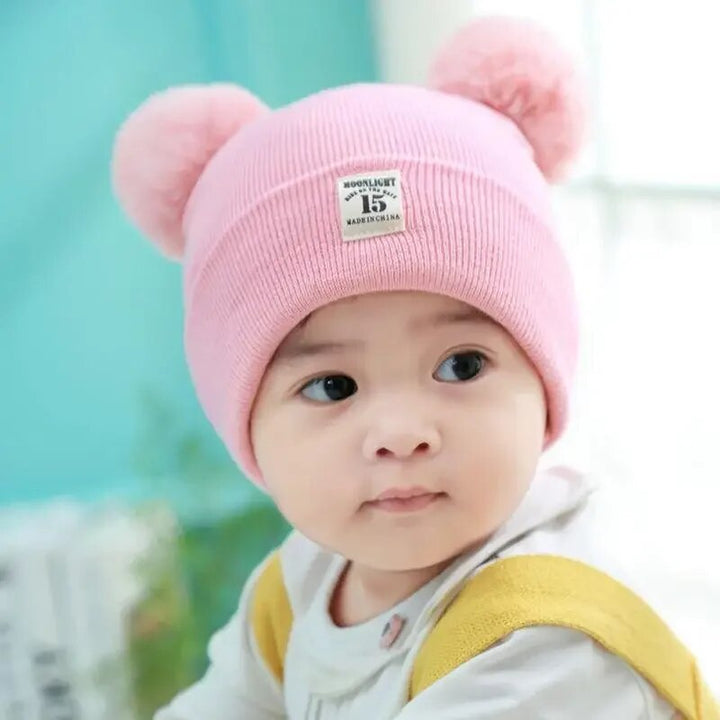 Warm toddler pom-pom beanie. Knit winter hat for kids, boys, or girls, ensuring cozy comfort & style.