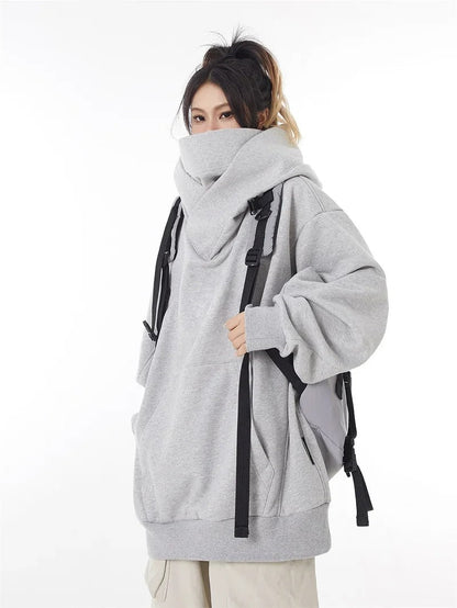 Stylish woman wearing a relaxed fit oversized hoodie, perfect for casual fall fashion.
