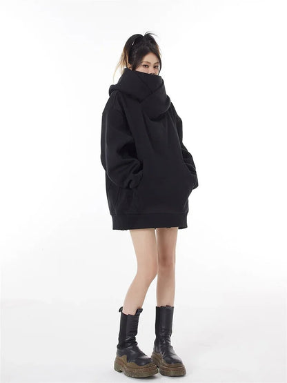 Close-up of a cozy oversized women's hoodie, emphasizing its comfortable texture and fit.