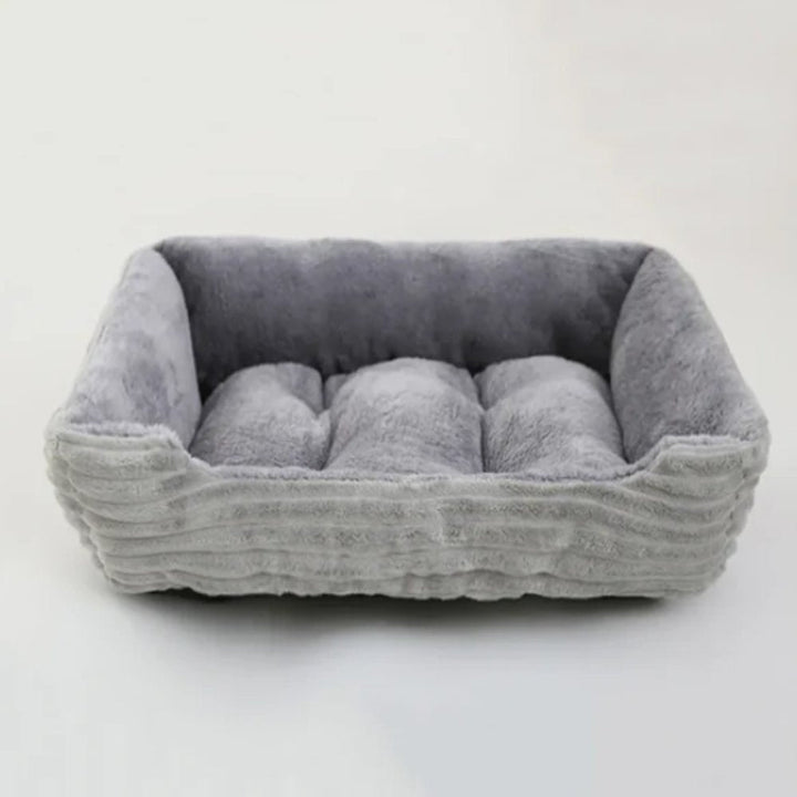 Cozy plush dog bed for ultimate pet comfort; soft, washable design.