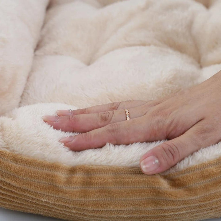 Luxury pet bed, round & plush for dogs, ultimate comfort, machine washable.