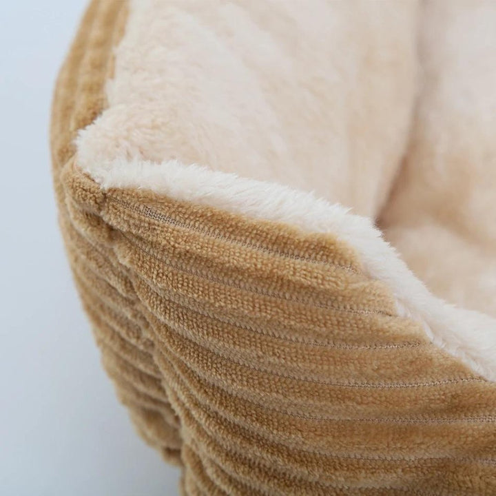 Soft, cozy dog bed, plush material, non-slip bottom for pet safety and comfort.