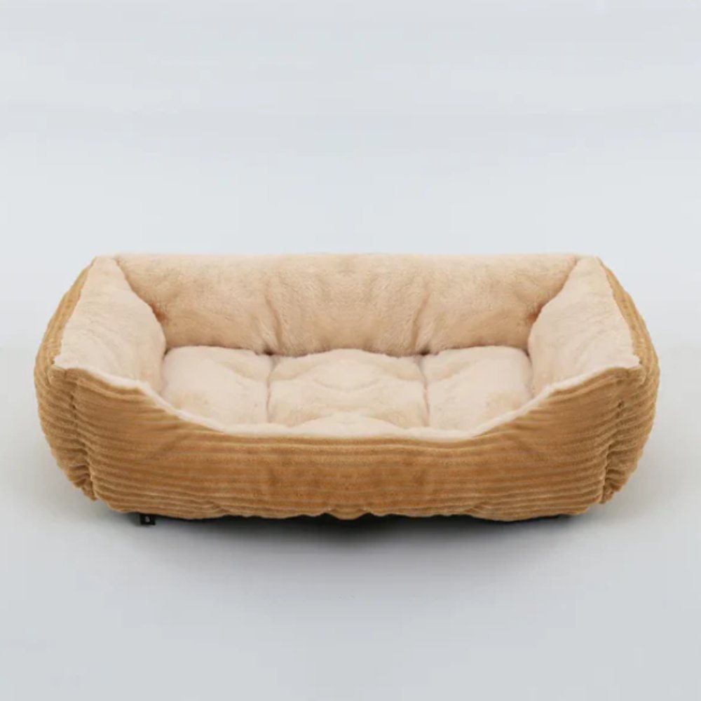 Deep-cushioned pet bed, ultra-soft plush, providing cozy comfort for dogs & cats.