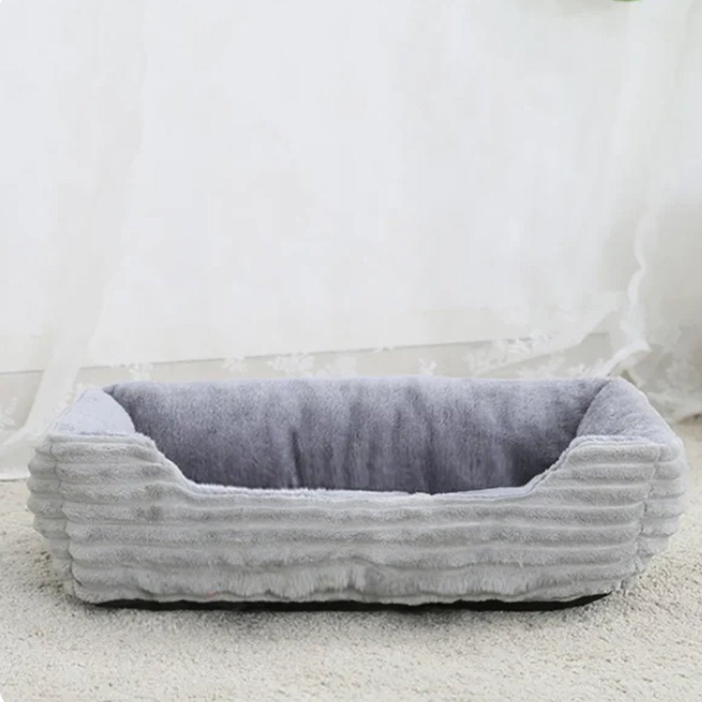Comfortable dog bed, plush fabric, designed for pet relaxation, easy to clean.