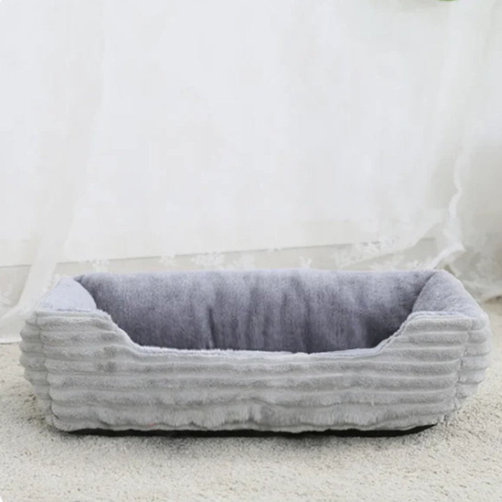 Comfortable dog bed, plush fabric, designed for pet relaxation, easy to clean.