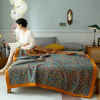 Cozy Six-Layer Cotton Duvet Quilt in vibrant orange & blue pattern. Soft, reversible bedding for comfort.