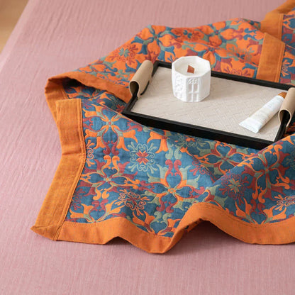 Soft, eco-friendly six-layer cotton bedding. Reversible orange and blue patterned duvet quilt adds vibrant home decor.