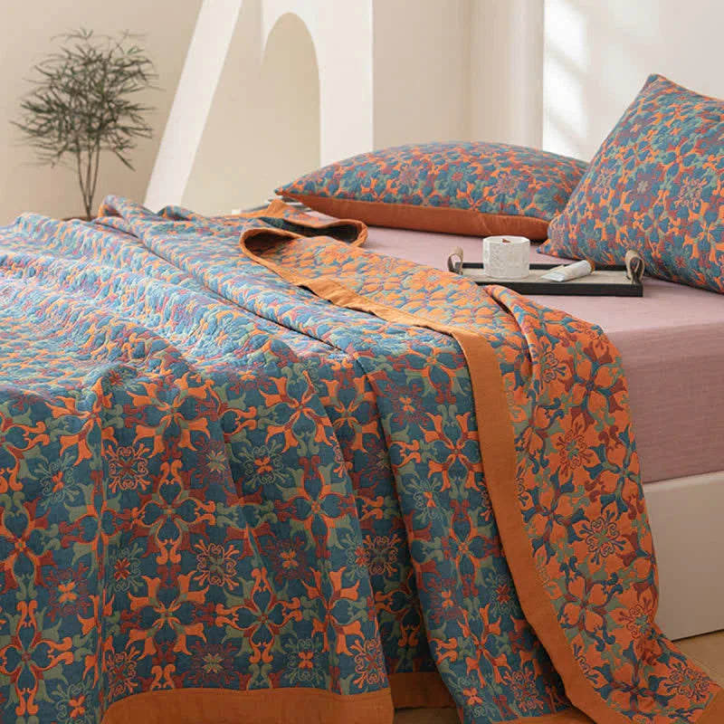 Premium six-layer cotton duvet quilt with a striking orange and blue reversible pattern. Eco-friendly bedding.