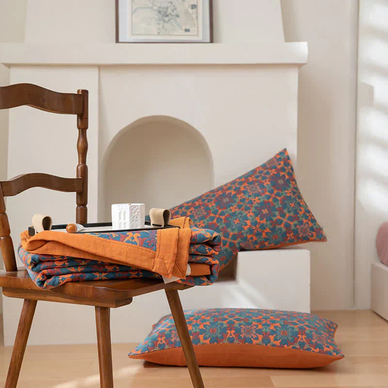 Plush six-layer cotton quilt, featuring a cheerful orange and blue design, brings cozy comfort to your bedroom.