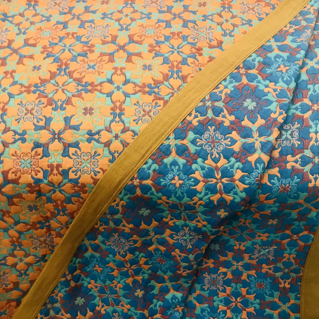 Cozy Six-Layer Cotton Duvet Quilt with orange & blue pattern, offering ultimate bedroom comfort.