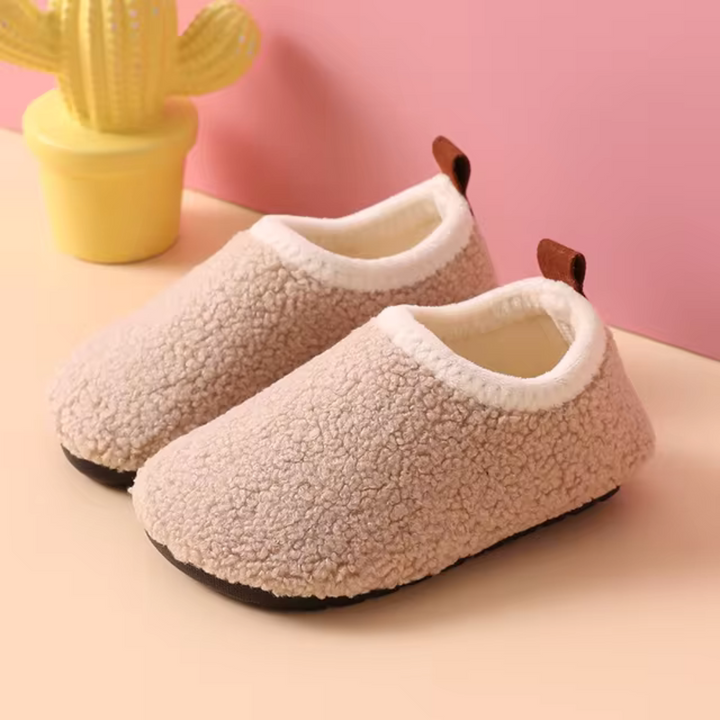 SnuggleSteps warm kids slippers. Cozy, non-slip house shoes for toddlers & children's indoor comfort.