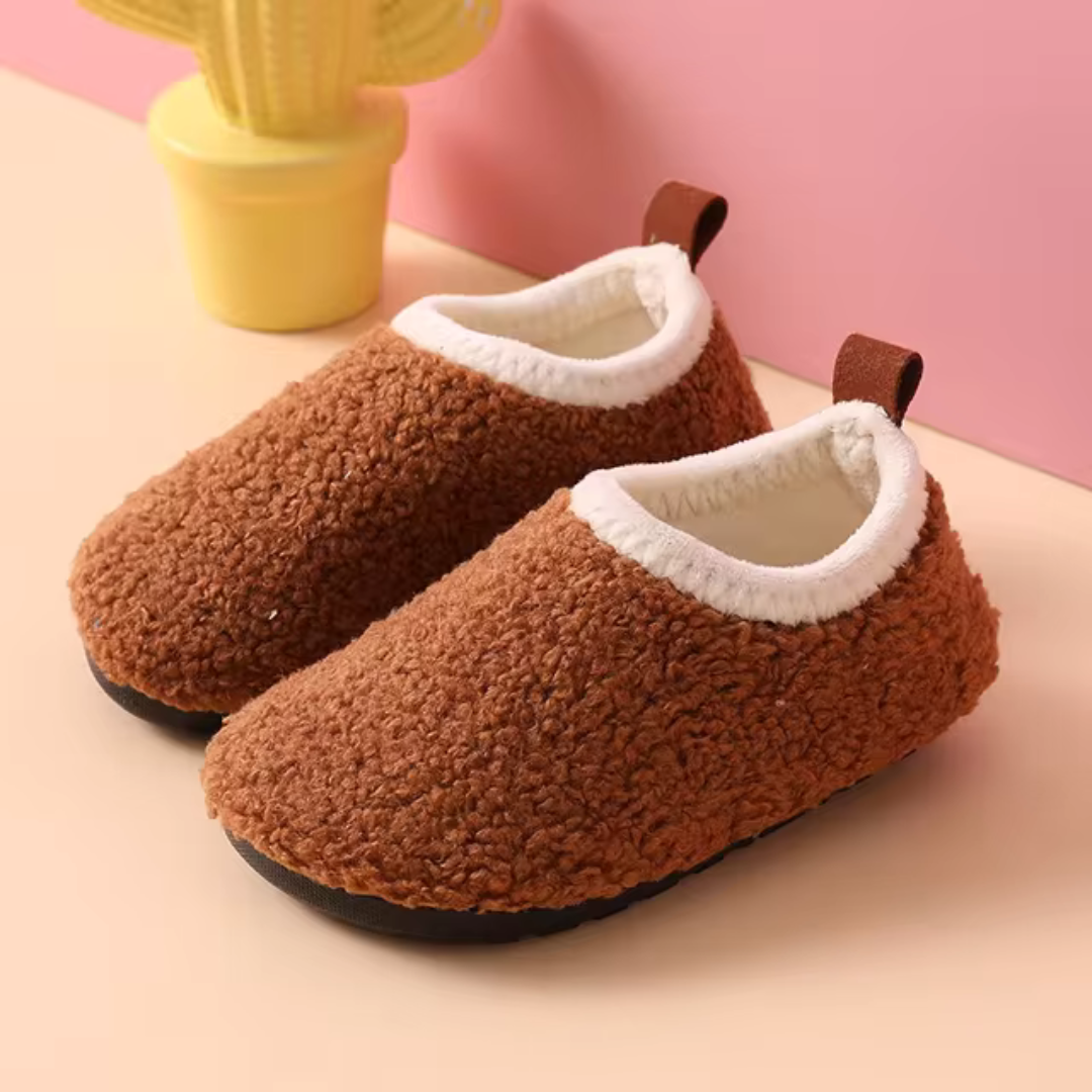 Non-slip warm children's house slippers. Ultra-soft indoor footwear for cozy comfort and secure steps.