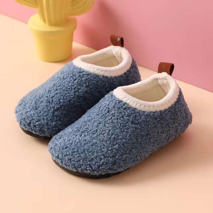 Warm children's cozy slippers. Soft, non-slip indoor house shoes for toddlers and kids' comfort.