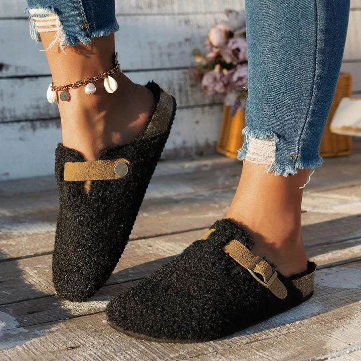 Stylish women's warm slip-on mules, ultimate comfort for winter indoor footwear.