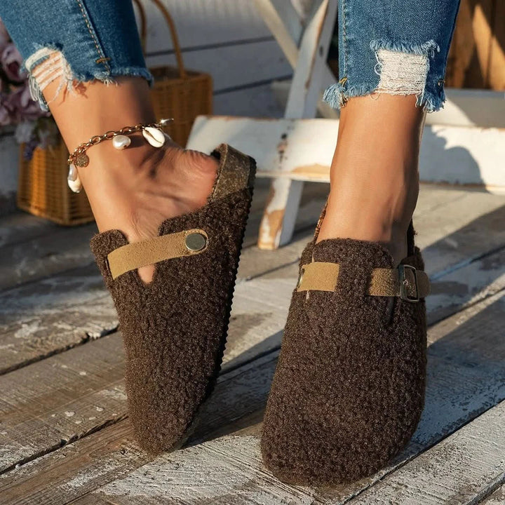 Warm women's slip-on footwear, cozy mules for ultimate winter comfort indoors.