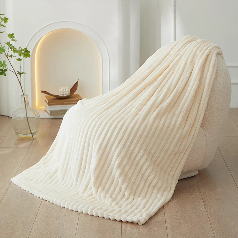Warm wide striped flannel throw, essential for cozy winter evenings and home decor.