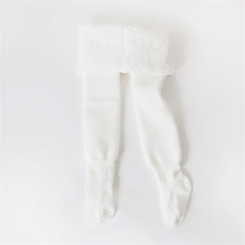 Cozy winter tights for active girls, perfect for cold weather play. Soft, warm kids hosiery with elastic fit.