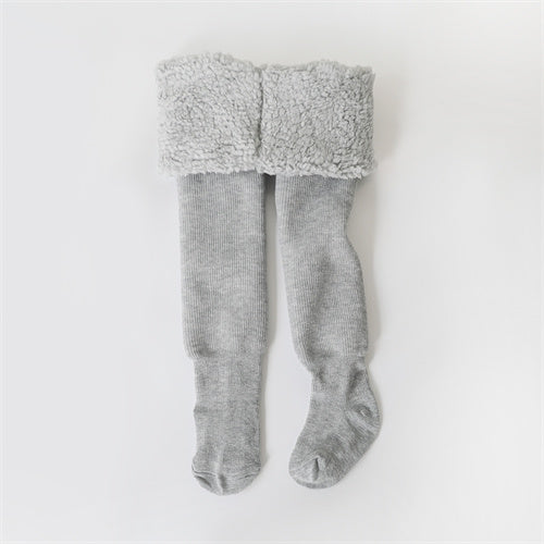 Warm girls' winter tights, essential cold weather wear for active kids. Soft, elastic fit hosiery for play.
