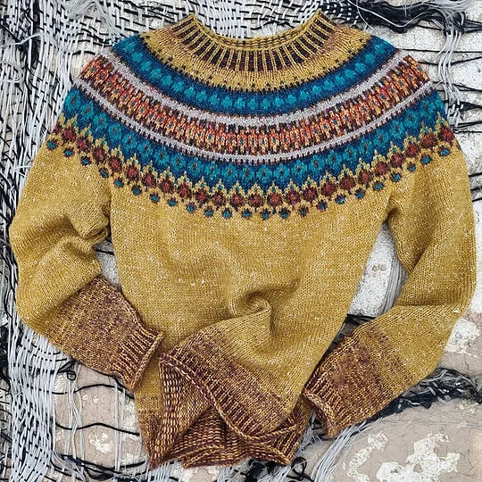 Stylish women's relaxed fit Fair Isle knit sweater, a warm long-sleeve crew neck for comfy holiday wear.