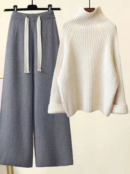 Relaxed fit women's knit lounge set. Stylish turtleneck and wide-leg pants for comfortable home wear.