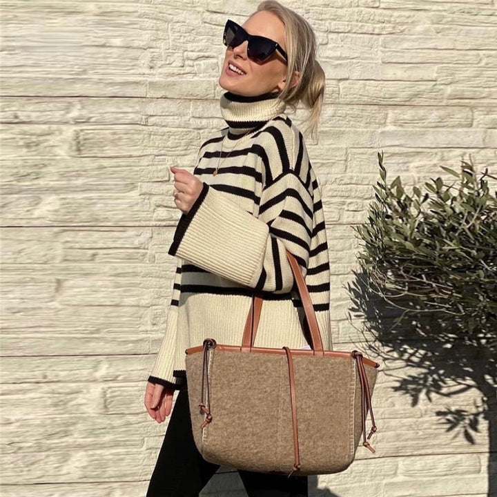 Chic women's turtleneck pullover, a comfortable and warm knit sweater for versatile cold-weather style.
