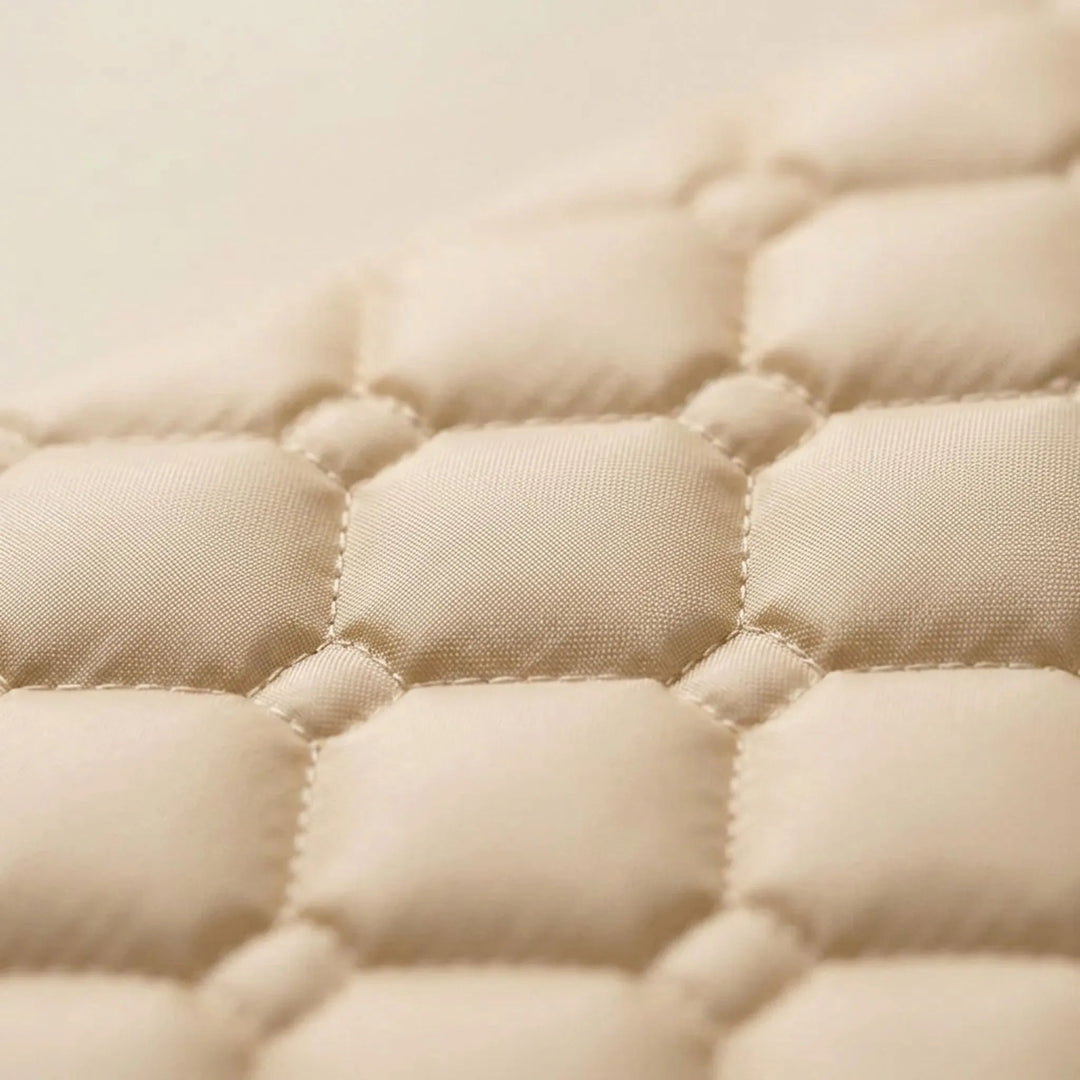Unisex cream self-inflating camp mat with attached pillow, providing comfort for all outdoor adventures.