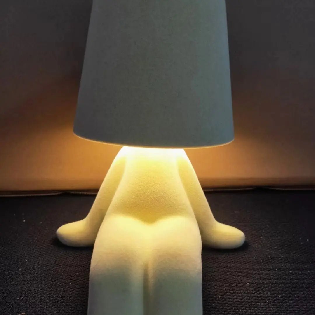 Decorative human-shaped LED lamp, enhancing room ambiance with artistic light.