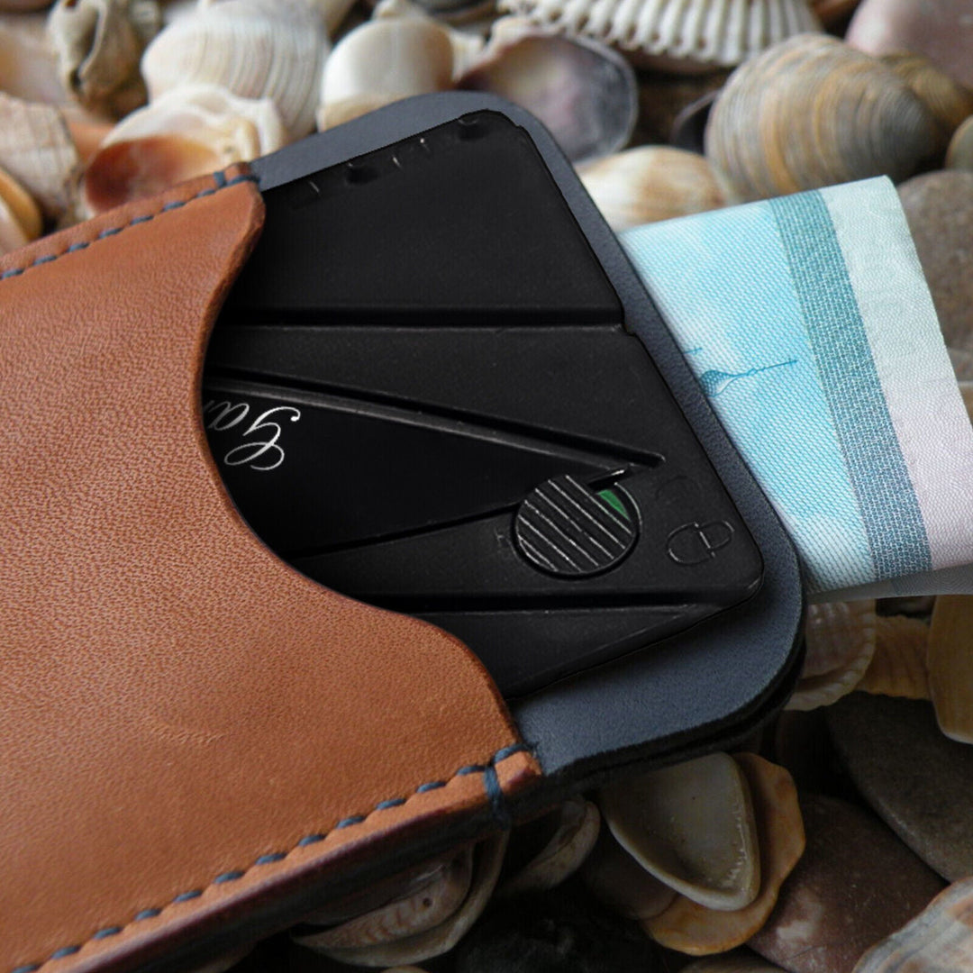 Credit card size pocket knife, a slim everyday carry utility tool for survival and camping.