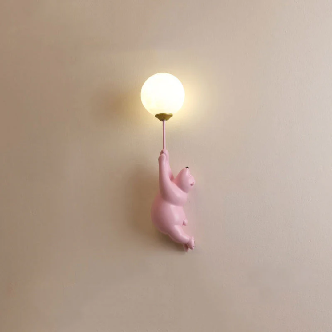 Playful bear LED wall lamp, TeddyGlow design, adds charming light to kids' rooms & nurseries.