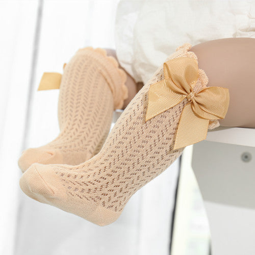 Cute cotton baby girl ankle socks with a large bow detail. Soft & comfortable infant apparel.