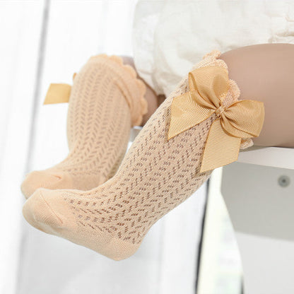 Cute cotton baby girl ankle socks with a large bow detail. Soft & comfortable infant apparel.