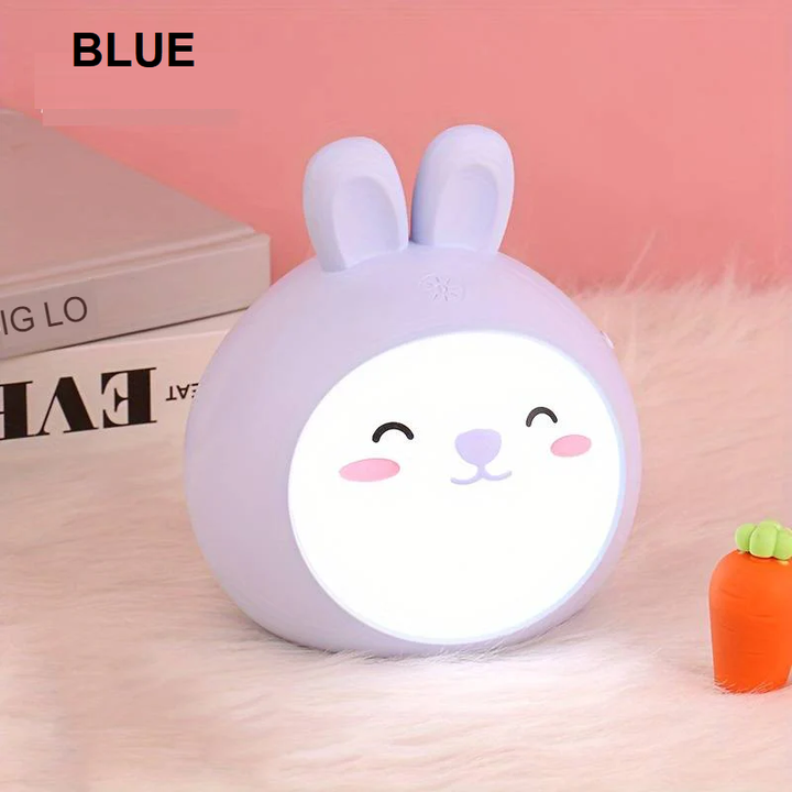Portable CuddlePaw LED night light for kids. Battery-operated, cute lamp provides calming light.